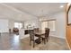 Open concept dining room featuring a modern chandelier and neutral tones at 6435 Parrot Ridge Ct, Las Vegas, NV 89139