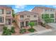 Charming two-story home featuring a tile roof, desert landscaping, and an inviting front porch at 6435 Parrot Ridge Ct, Las Vegas, NV 89139