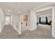 Upstairs hallway featuring an art piece on the wall, neutral colors, and plush carpet at 6435 Parrot Ridge Ct, Las Vegas, NV 89139