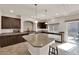 Well-equipped kitchen with a large island, sleek countertops, and stylish fixtures at 6435 Parrot Ridge Ct, Las Vegas, NV 89139