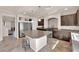 Modern kitchen with stainless steel appliances and a large center island for seating at 6435 Parrot Ridge Ct, Las Vegas, NV 89139