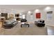 Spacious living room with ample seating and a seamless connection to the kitchen at 6435 Parrot Ridge Ct, Las Vegas, NV 89139