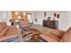 An expansive living room with tile floors and a modern furniture set at 6435 Parrot Ridge Ct, Las Vegas, NV 89139