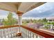 Exterior balcony view features a white rail and column overlooking the neighborhood landscape at 6491 Bright Nimbus Ave, Las Vegas, NV 89139