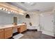 Bright bathroom featuring double sinks, separate shower, and a luxurious corner bathtub at 6491 Bright Nimbus Ave, Las Vegas, NV 89139