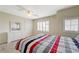 Bright bedroom with shutters, ceiling fan, dresser and soft carpet at 6491 Bright Nimbus Ave, Las Vegas, NV 89139