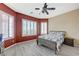 Bedroom with wood-look floors, neutral walls, a ceiling fan and shuttered windows at 6491 Bright Nimbus Ave, Las Vegas, NV 89139