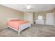 A cozy bedroom features neutral tones, a ceiling fan, and soft carpet at 6491 Bright Nimbus Ave, Las Vegas, NV 89139