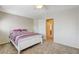 Cozy bedroom featuring a ceiling fan and an open doorway to another room at 6491 Bright Nimbus Ave, Las Vegas, NV 89139