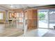 View of dining area with tile flooring and folding shutter doors that lead to the pool area at 6491 Bright Nimbus Ave, Las Vegas, NV 89139
