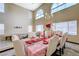 Elegant dining area with high ceilings, chandelier, and beautifully set table at 6491 Bright Nimbus Ave, Las Vegas, NV 89139