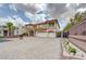 Attractive two-story home featuring a three-car garage and desert landscaping at 6491 Bright Nimbus Ave, Las Vegas, NV 89139