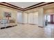 A large foyer with tiled flooring and decorative mirror, perfect for welcoming guests at 6491 Bright Nimbus Ave, Las Vegas, NV 89139