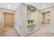 Hallway with neutral walls, carpet, decorative alcove and access to rooms at 6491 Bright Nimbus Ave, Las Vegas, NV 89139