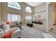 Open-concept living room and dining area with cathedral windows and decorative accents at 6491 Bright Nimbus Ave, Las Vegas, NV 89139