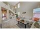 Spacious living room features high ceilings, lots of natural light, and stylish decor at 6491 Bright Nimbus Ave, Las Vegas, NV 89139