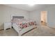 Bright main bedroom with ensuite bath featuring a large bed and nightstand at 6491 Bright Nimbus Ave, Las Vegas, NV 89139