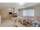 Carpeted Main bedroom featuring a fireplace and comfortable bed at 6491 Bright Nimbus Ave, Las Vegas, NV 89139