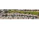 Aerial view of homes in a golf community showing landscaping and mature trees, highlighted with a blue border at 7567 Wingspread St, North Las Vegas, NV 89084