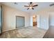 Cozy bedroom with plush carpet and an adjoining bathroom at 7567 Wingspread St, North Las Vegas, NV 89084