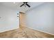 Bedroom with neutral walls and carpet, a ceiling fan, and an open doorway enhancing the spacious atmosphere at 7567 Wingspread St, North Las Vegas, NV 89084