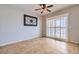 Dining area with plantation shutters, large decorative art and sliding doors for an abundance of natural light at 7567 Wingspread St, North Las Vegas, NV 89084