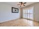 Bright dining area featuring tile flooring, ceiling fan, and sliding door access at 7567 Wingspread St, North Las Vegas, NV 89084