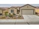 Inviting single-story home with well-maintained landscaping and a spacious driveway at 7567 Wingspread St, North Las Vegas, NV 89084
