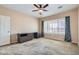 The main bedroom includes a ceiling fan, neutral tones, and a window for natural light, promoting relaxation at 7567 Wingspread St, North Las Vegas, NV 89084