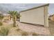 Covered patio featuring brick flooring, shade screen, desert landscaping, and mature palm tree at 7567 Wingspread St, North Las Vegas, NV 89084