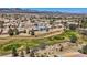 Back exterior view of a beautiful house on a golf course, boasting picturesque views and serene backyard at 7567 Wingspread St, North Las Vegas, NV 89084