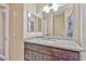 Bright bathroom with granite countertop, vanity, and a tiled shower-tub combo at 7581 Slipstream St, Las Vegas, NV 89139