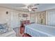 Cozy bedroom featuring a ceiling fan, and cherry wood floors at 7581 Slipstream St, Las Vegas, NV 89139