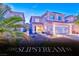 Charming two-story home with a two-car garage and well-manicured front yard at 7581 Slipstream St, Las Vegas, NV 89139