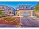 Charming two-story home features manicured lawn and a two-car garage at 7581 Slipstream St, Las Vegas, NV 89139