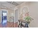 Upper hallway with hardwood floors, stylish decor, and access to bedrooms at 7581 Slipstream St, Las Vegas, NV 89139