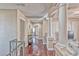 Hallway with hardwood floors, decorative pillars, and ample natural light at 7581 Slipstream St, Las Vegas, NV 89139