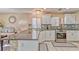Bright kitchen featuring granite countertops, stainless steel appliances, and a view of the dining area at 7581 Slipstream St, Las Vegas, NV 89139