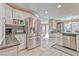 Open kitchen features stainless steel refrigerator and modern appliances at 7581 Slipstream St, Las Vegas, NV 89139