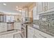 Stylish kitchen boasts granite counters, stainless appliances, and decorative backsplash tiles at 7581 Slipstream St, Las Vegas, NV 89139