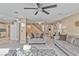 Open-concept living room featuring neutral tones, recessed lighting, and stylish furnishings and decor at 7581 Slipstream St, Las Vegas, NV 89139
