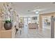 Open-concept living area with tile floors, contemporary furnishings, and bright natural light at 7581 Slipstream St, Las Vegas, NV 89139