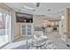 Open living space with access to the kitchen, outdoor pool, and featuring a built-in entertainment center at 7581 Slipstream St, Las Vegas, NV 89139