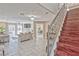 Open-concept living room with tile floors, fireplace, and easy access to the stairway and dining area at 7581 Slipstream St, Las Vegas, NV 89139