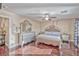 Spacious main bedroom featuring hardwood floors, elegant furnishings, and a ceiling fan at 7581 Slipstream St, Las Vegas, NV 89139