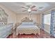 Well-appointed main bedroom with hardwood floors, a stylish bed frame, and natural lighting at 7581 Slipstream St, Las Vegas, NV 89139