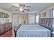 Spacious primary bedroom features a ceiling fan, wood floors and natural light at 7581 Slipstream St, Las Vegas, NV 89139