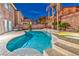 Backyard featuring a stunning pool, patio, and lush tropical landscaping at 7581 Slipstream St, Las Vegas, NV 89139