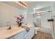 Bright bathroom featuring a double vanity sink and tub-shower combo at 800 Fetter Ct, Henderson, NV 89052