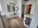 Bright bathroom features dual sinks, white cabinetry, and light wood flooring at 800 Fetter Ct, Henderson, NV 89052
